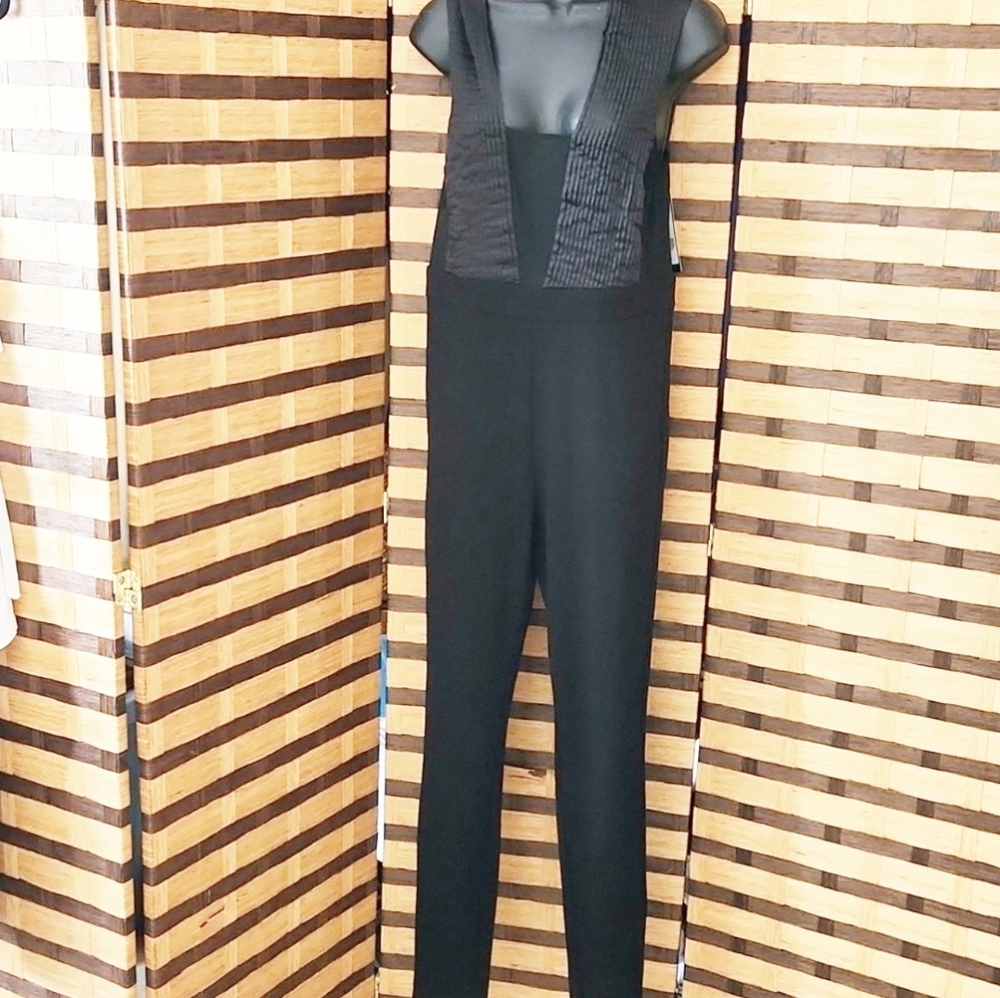 NWT!! Bebe catsuit zip back open back